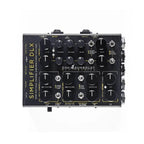 A black DSM-HUMBOLDT Simplifier DLX audio effects pedal with multiple black rotary knobs and white text labels, photographed from a top-down angle on a solid white background.